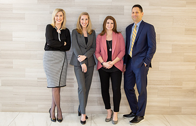 Employees standing in hallway