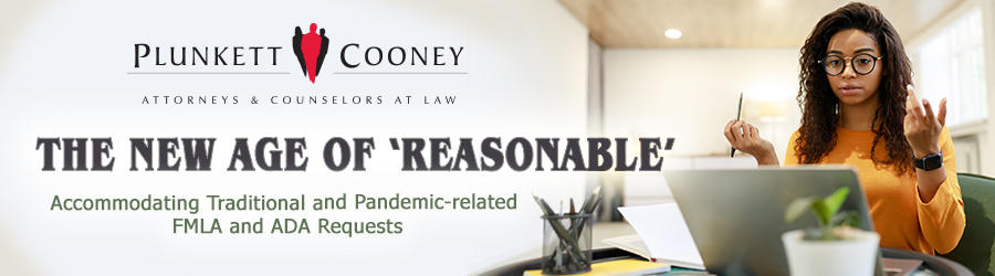 Woman with hands in air reviewing accommodation request on laptop